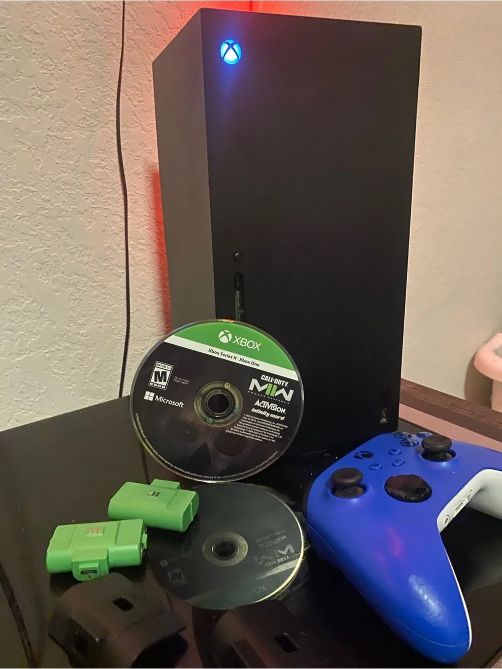 Series X Console with Blue Controller and Green Accessories